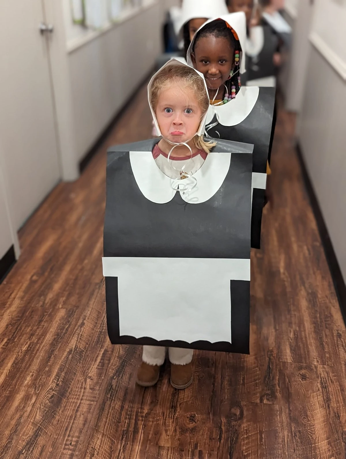 Children enjoying winter holiday celebrations at school