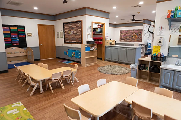 Two-year-olds developing social skills through creative play and art activities in our Butterflies classroom