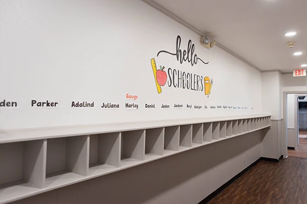 Elementary school students receiving homework support and engaging in enrichment activities in our Schoolers program