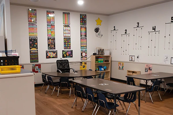 Four-year-olds developing early literacy and math skills through hands-on learning in our Dragonflies Pre-K program