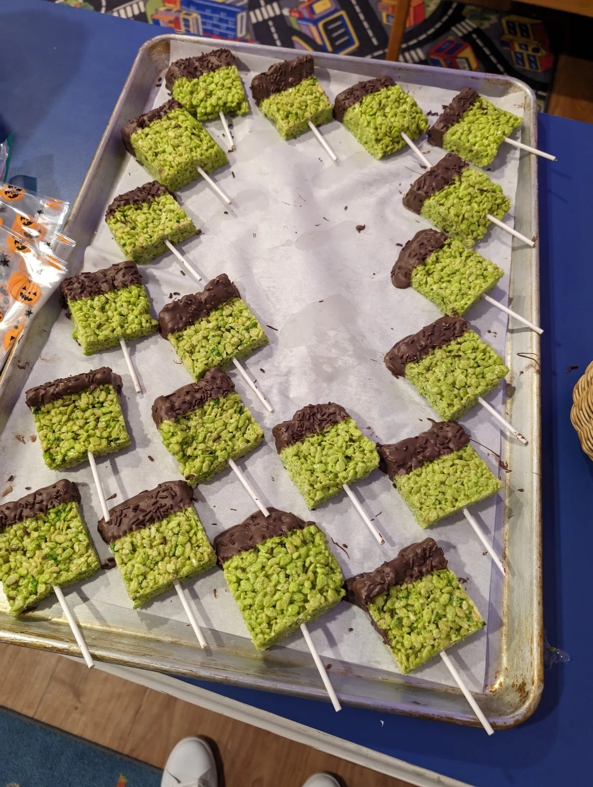 Children creating colorful paintings at art easels